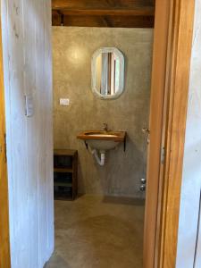 a bathroom with a sink and a mirror on the wall at A Modo Mío in San Carlos de Bariloche