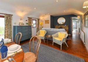 a living room with a couch and a table at Trefaes Bach in Abersoch