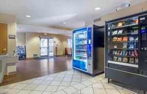 a store with a large refrigerator in a room at Extended Stay America Suites - Boston - Waltham - 32 4th Ave in Waltham