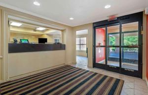 an empty lobby with an office with a desk at Extended Stay America Suites - Hanover - Parsippany in Whippany