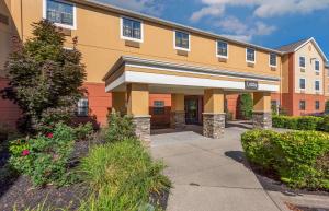 a large building with a walkway in front of it at Extended Stay America Suites - Buffalo - Amherst in Amherst