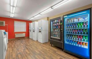 a large soda vending machine in a room at Extended Stay America Suites - Buffalo - Amherst in Amherst