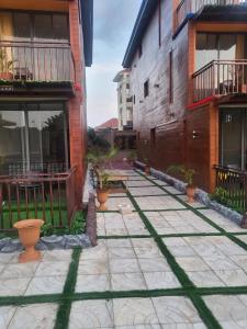 a courtyard of a building with potted plants at Wisdom Villa in Kumasi