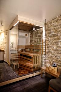 a bathroom with a glass shower and a sink at Toompea Castle Apartment in Tallinn +35 photos