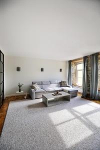 a living room with a couch and a rug at Toompea Castle Apartment in Tallinn