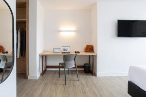 TV a/nebo společenská místnost v ubytování Sooz Hotel Collection