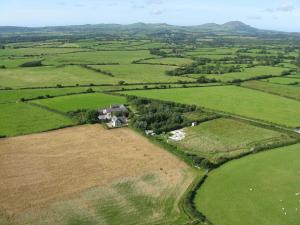an aerial view of a house in a field at RB Contractor Stays - Helyg in Pwllheli +7 photos