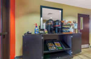 a counter with a shelf with food and a mirror at Extended Stay America Suites - Washington, DC - Chantilly - Dulles South in Chantilly