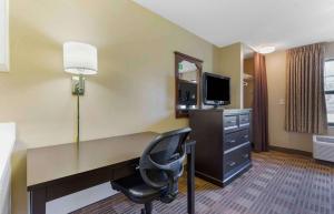 a hotel room with a desk and a chair at Extended Stay America Suites - Washington, DC - Chantilly - Dulles South in Chantilly
