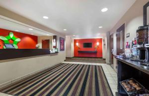 a lobby of a fast food restaurant with red walls at Extended Stay America Suites - Washington, DC - Springfield in Springfield