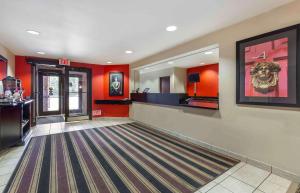 a lobby with red walls and a bowling alley at Extended Stay America Suites - Washington, DC - Springfield in Springfield