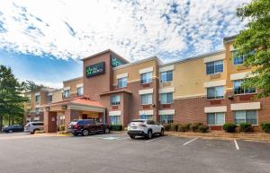 a hotel with cars parked in a parking lot at Extended Stay America Suites - Washington, DC - Tysons Corner in Tysons Corner