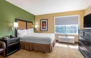 a hotel room with a bed and a window at Extended Stay America Suites - Washington, DC - Tysons Corner in Tysons Corner