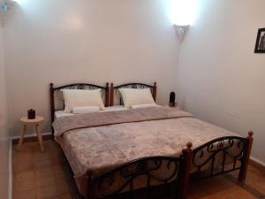 Ένα ή περισσότερα κρεβάτια σε δωμάτιο στο Riad Hostel JAD ZIAD