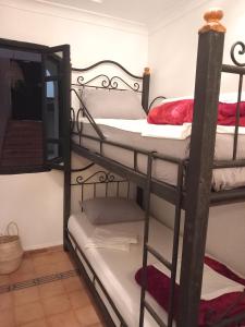 Ένα ή περισσότερα κρεβάτια σε δωμάτιο στο Riad Hostel JAD ZIAD