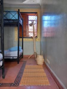 Ένα ή περισσότερα κρεβάτια σε δωμάτιο στο Riad Hostel JAD ZIAD