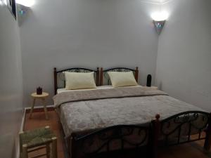 Ένα ή περισσότερα κρεβάτια σε δωμάτιο στο Riad Hostel JAD ZIAD