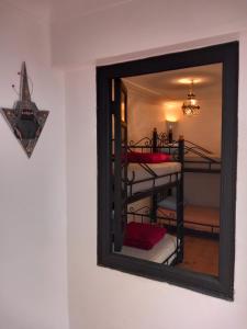Ένα ή περισσότερα κρεβάτια σε δωμάτιο στο Riad Hostel JAD ZIAD