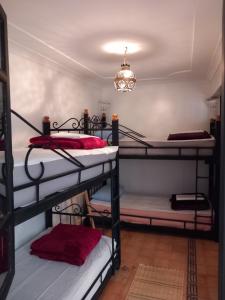 Ένα ή περισσότερα κρεβάτια σε δωμάτιο στο Riad Hostel JAD ZIAD