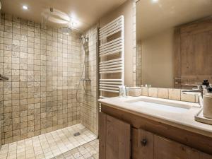 a bathroom with a large sink and a shower at Appartement Neuf et Luxueux Centre Courchevel 1850, Proche Pistes et Services - FR-1-575-160 in Courchevel