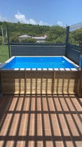 a small swimming pool on top of a deck at Ti-Kaz Gwada Le Gosier in Le Gosier