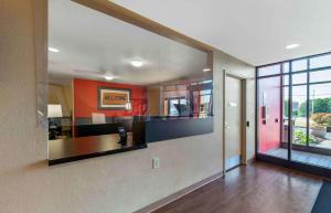a large kitchen with a large mirror on the wall at Extended Stay America Select Suites - Rockford - State Street in Rockford