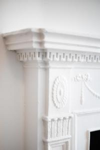 a white fireplace with a white mantel at Sleepover No 107 in Philadelphia