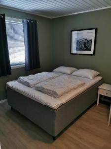 En eller flere senge i et værelse på Bjorligård leilighet 17