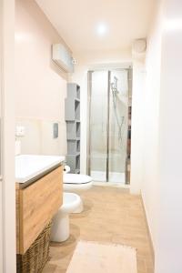 a bathroom with a toilet sink and a shower at Casa Pesa 2 rooms 2 baths Rome center in Rome