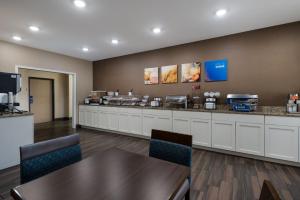 a fast food restaurant with a counter and chairs at Comfort Inn Onalaska - La Crosse Area in Onalaska