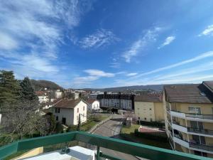 a view of a city from a balcony at CHEZ JOYCE Appartement cocooning in Lons-le-Saunier