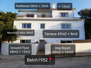 een wit huis met beschrijvingen van de voorkant bij BELCH1952 in Lagos