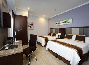 Postel nebo postele na pokoji v ubytování Hotel City Plaza & Suites