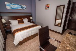 Postel nebo postele na pokoji v ubytování Hotel City Plaza & Suites