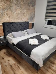 Postelja oz. postelje v sobi nastanitve Apartman Lux-besplatno korišćenje zasebne garaže