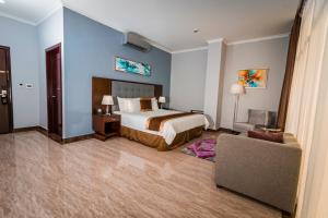 Postel nebo postele na pokoji v ubytování Hotel City Plaza & Suites