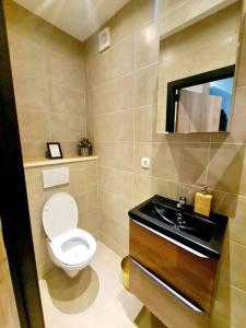 a bathroom with a toilet and a sink at New 2 bedrooms Luxury Flat - 19 in Luxembourg
