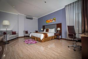Postel nebo postele na pokoji v ubytování Hotel City Plaza & Suites