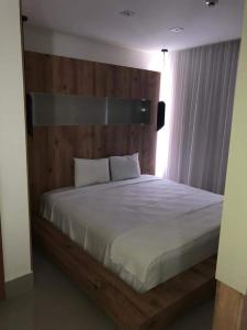 En eller flere senge i et værelse på Resort do Lago Park - Central de Reservas