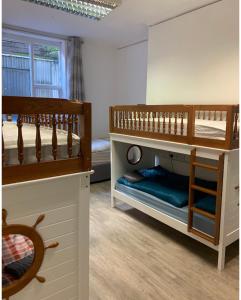 two sets of bunk beds in a room at The Ground Snug Private Room in Dublin