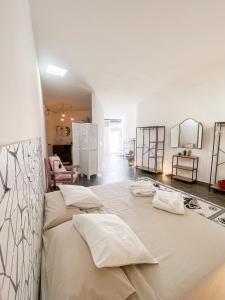 a large bed with two pillows in a room at CASA RURAL GA7COLORES only adult in Montaña Blanca