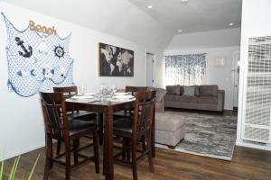 a dining room with a table and chairs at Surf city House in Huntington Beach