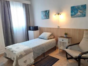 Postel nebo postele na pokoji v ubytování Hostal Nevada