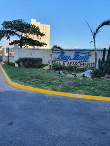 a wall with graffiti on it next to a street at Bayfront BlueDream Luxurious 1Bed, 1Ba Apt in Portmore