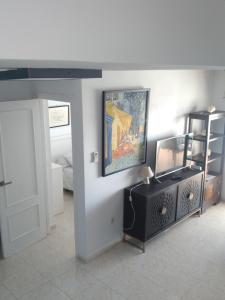 TV a/nebo společenská místnost v ubytování Atico Duplex 1ª