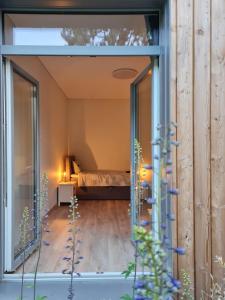 Ένα ή περισσότερα κρεβάτια σε δωμάτιο στο Miško Santorija