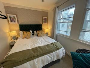 a bedroom with a large white bed with a window at Fantastic Liverpool City Centre Apartments, Fenwick Street in Liverpool