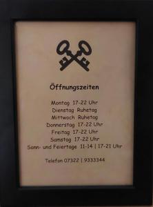a picture of a sign with two crossed scissors at Brauereigasthof Schlüsselkeller in Giengen an der Brenz