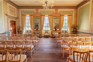 a room with a bunch of chairs in it at Lytham Hall Gate House in Lytham St Annes