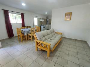 a living room with a couch and a table at Departamento San Luis 320 in General Roca